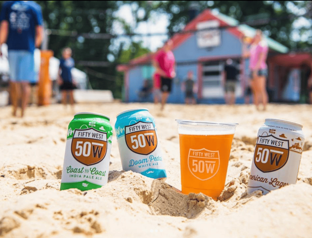 Drink offerings on the volleyball court at Fifty West Brewing Company